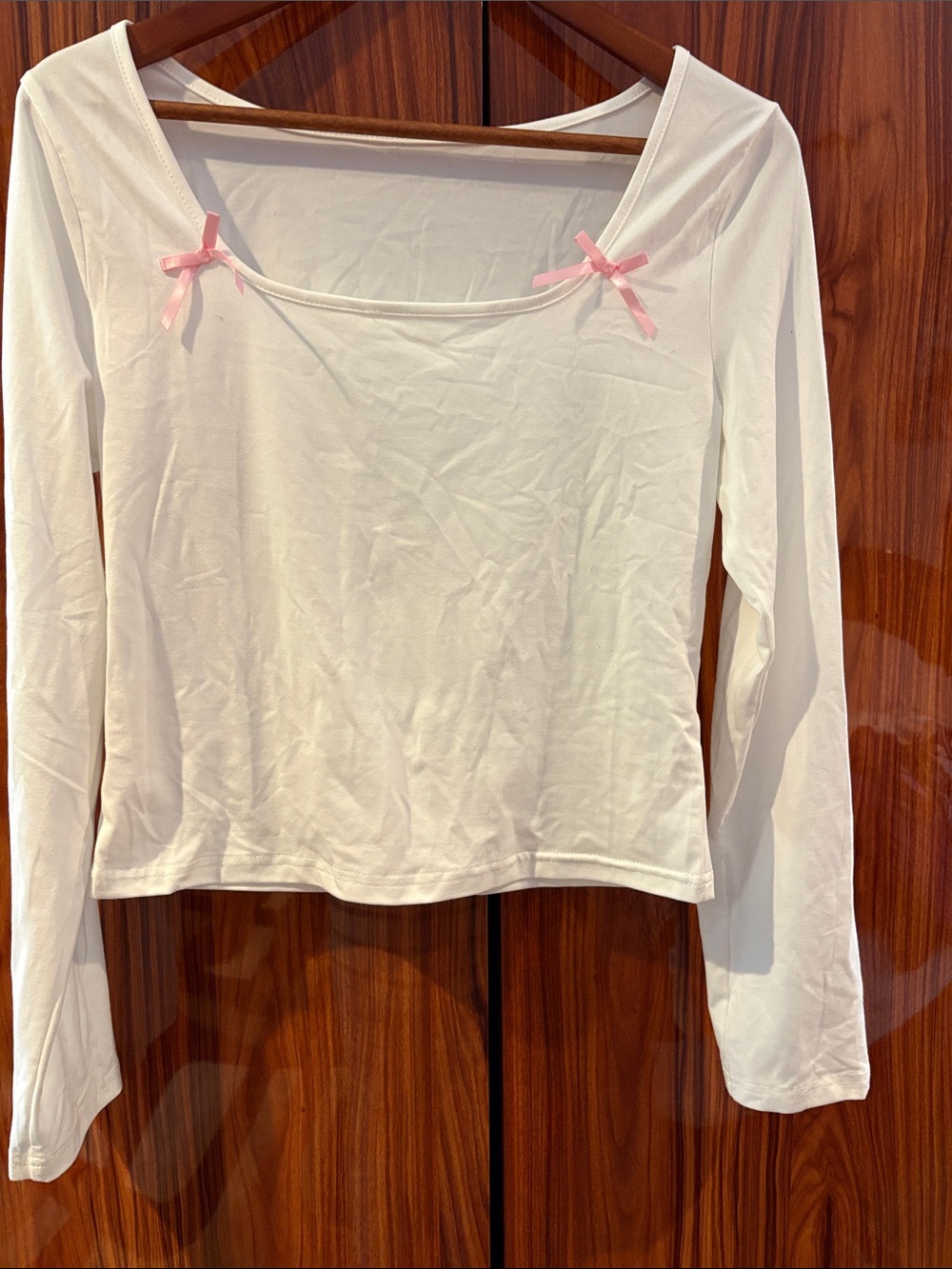 White Long-Sleeve Scoop Neck Top with Pink Bow Detail